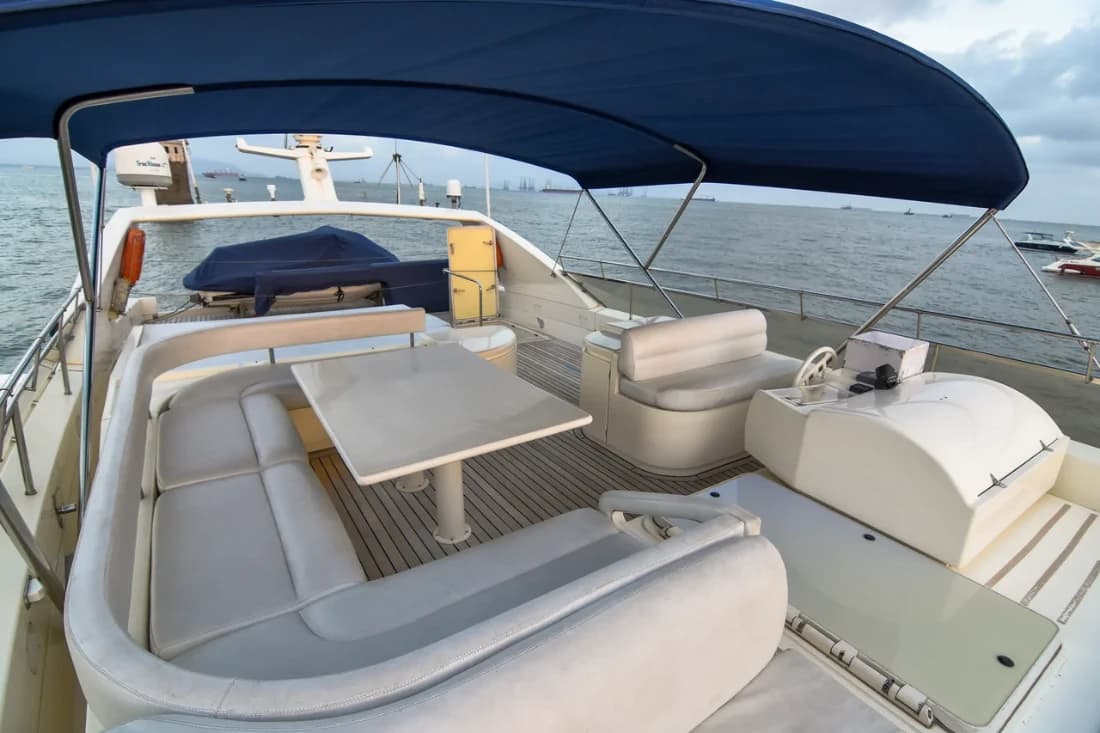 Flybridge storage lockers and wet bar unit, with harbour boats moored behind