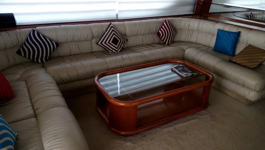 The saloon's cream leather lounge seating and wood coffee table